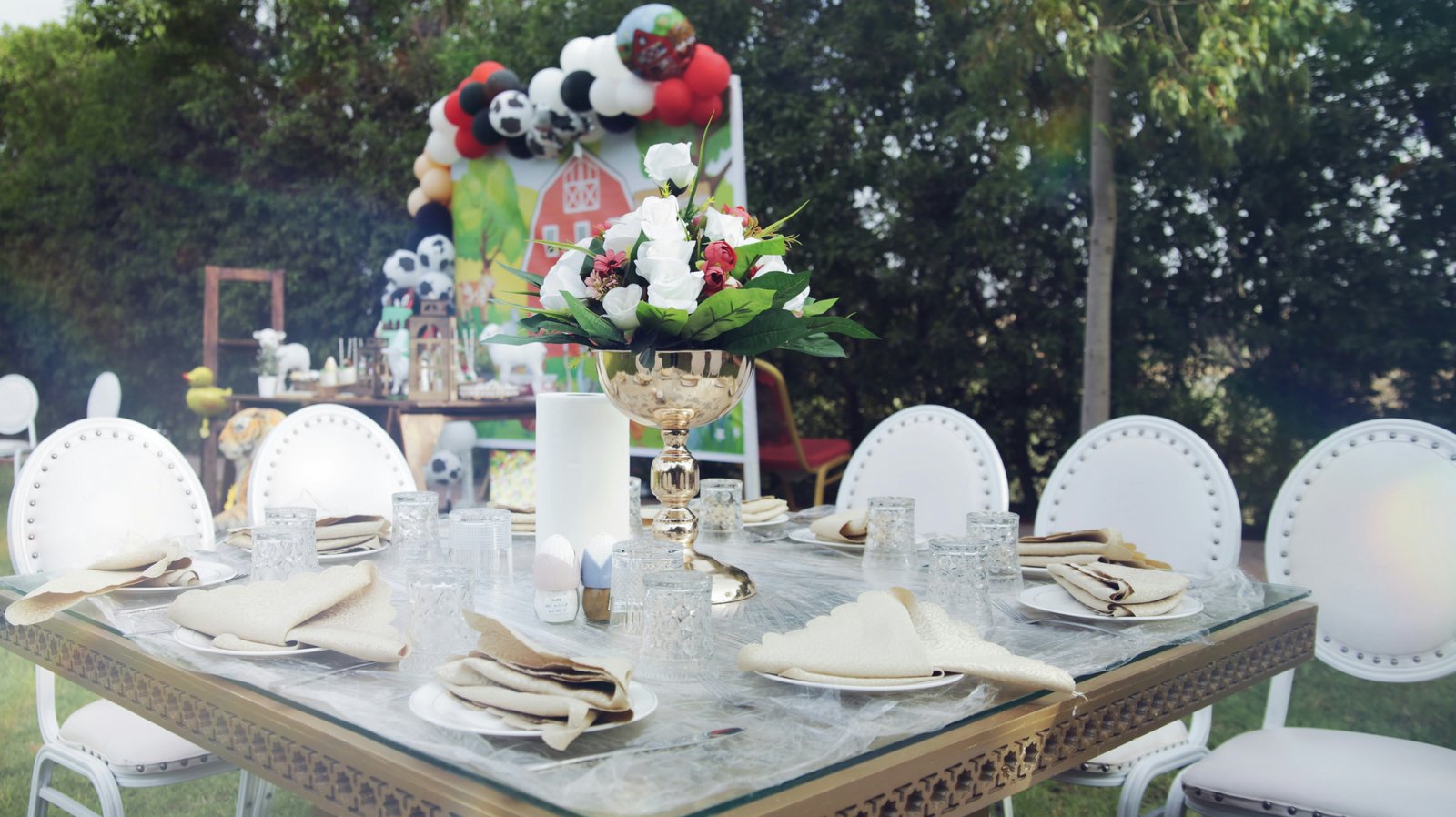 Farmhouse party table with food spread and festive decorations