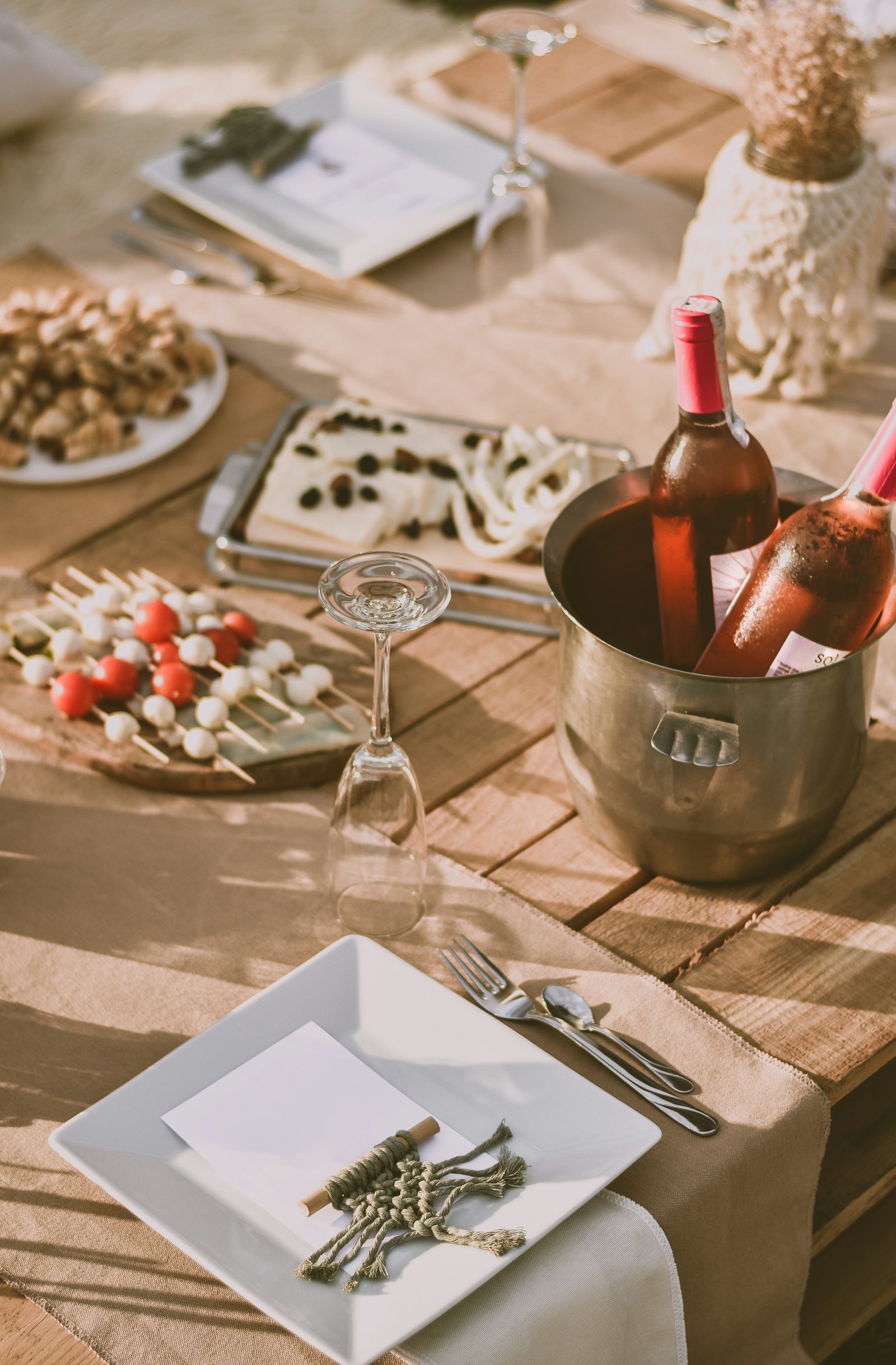 Party essentials including cold drinks, ice bucket, disposable plates and cups